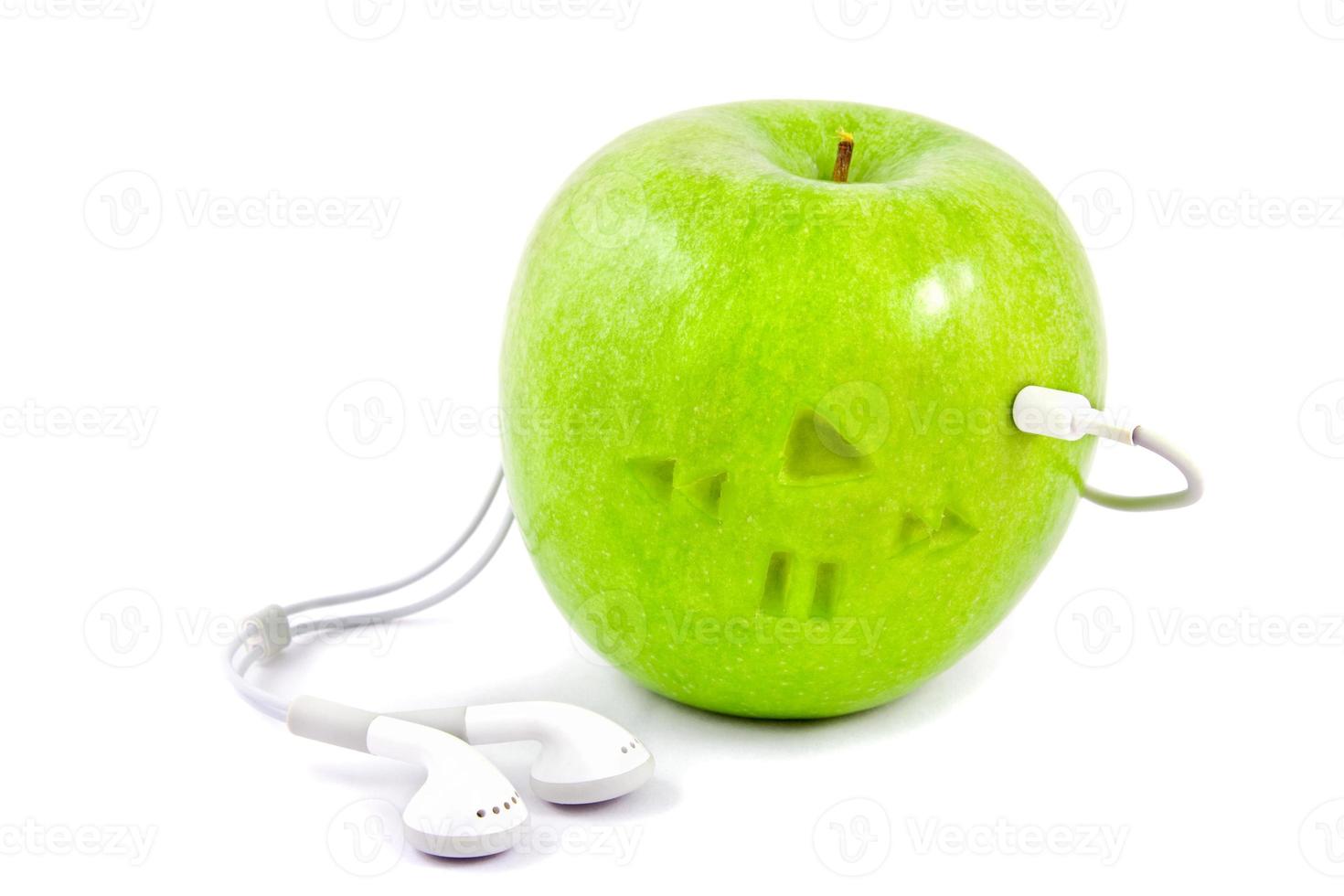 green apple with headphones photo