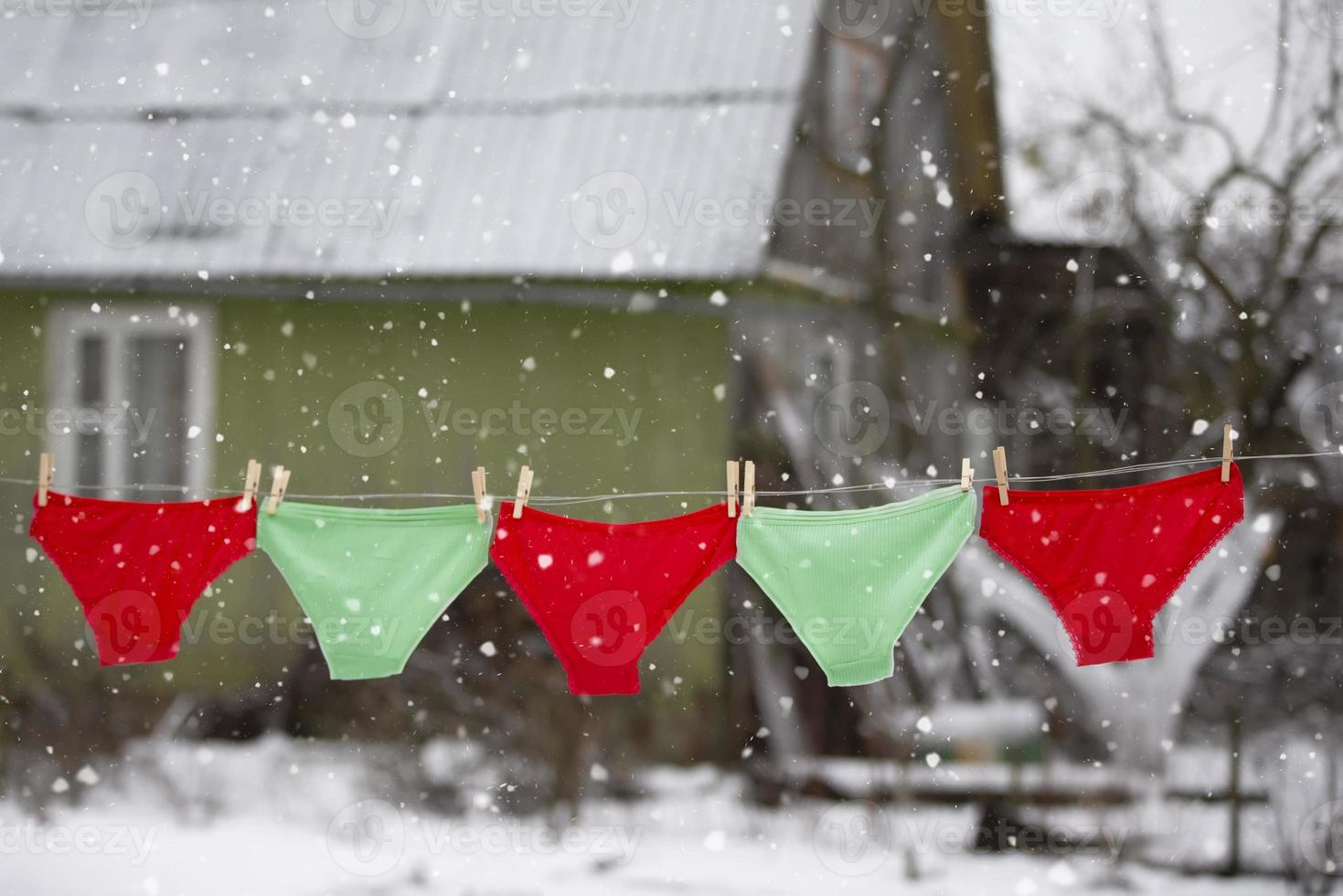 In winter, panties dry on a rope outside. photo