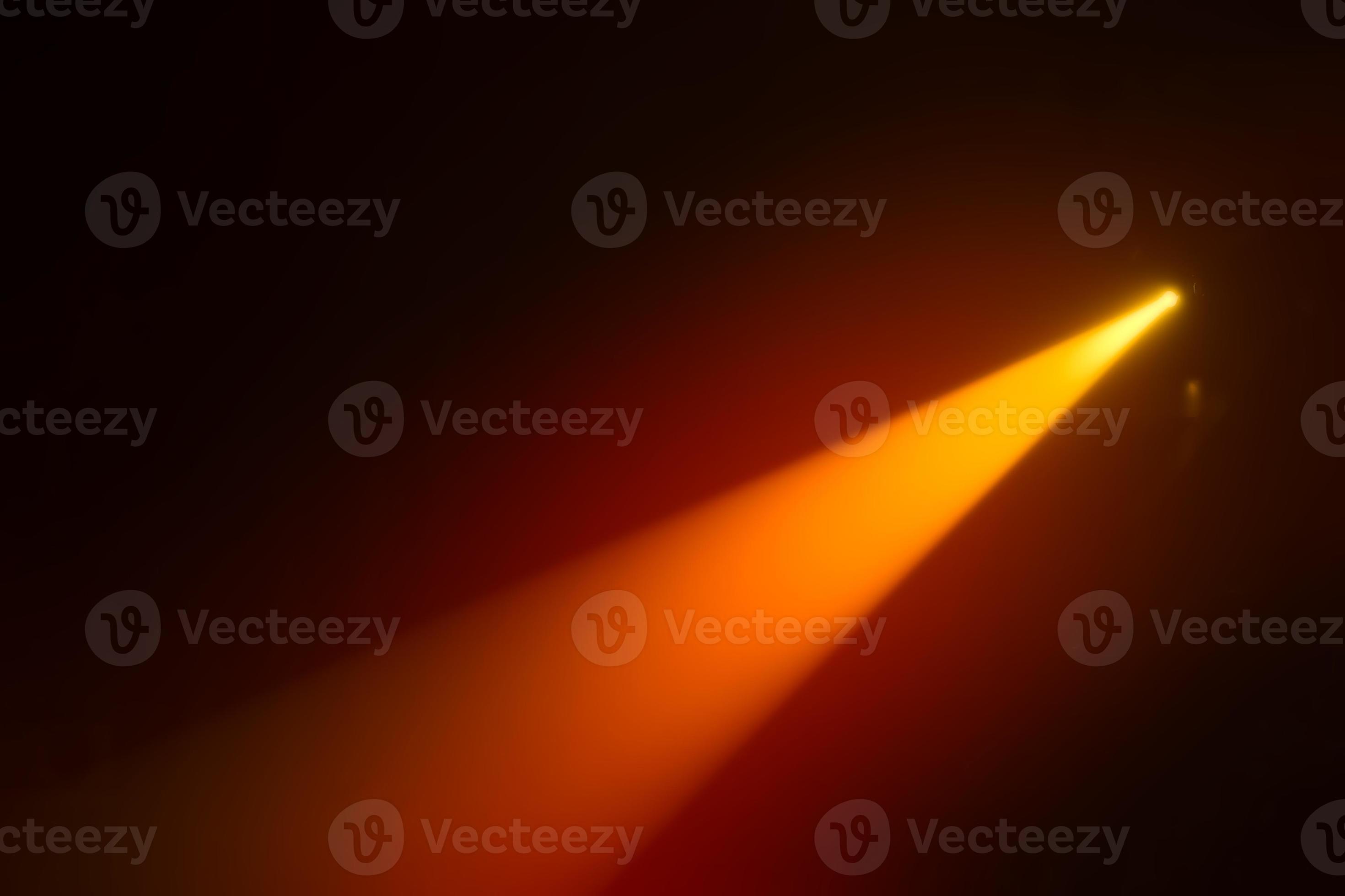Orange blurred beam of stage light on a dark background. 21195535 Stock Photo at Vecteezy