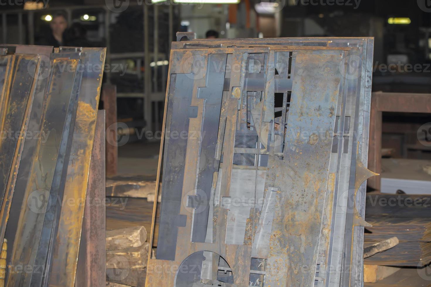 Sheets of metal and blanks in the workshop of a metallurgical plant or a metal working enterprise. photo