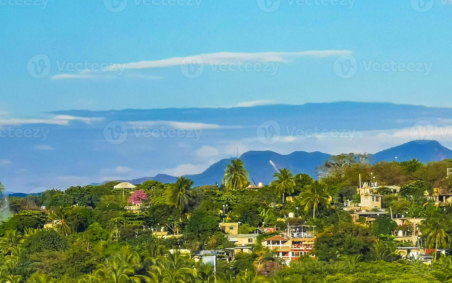 Mountain panorama cliffs rocks hilly tropical landscape Puerto Escondido Mexico. photo