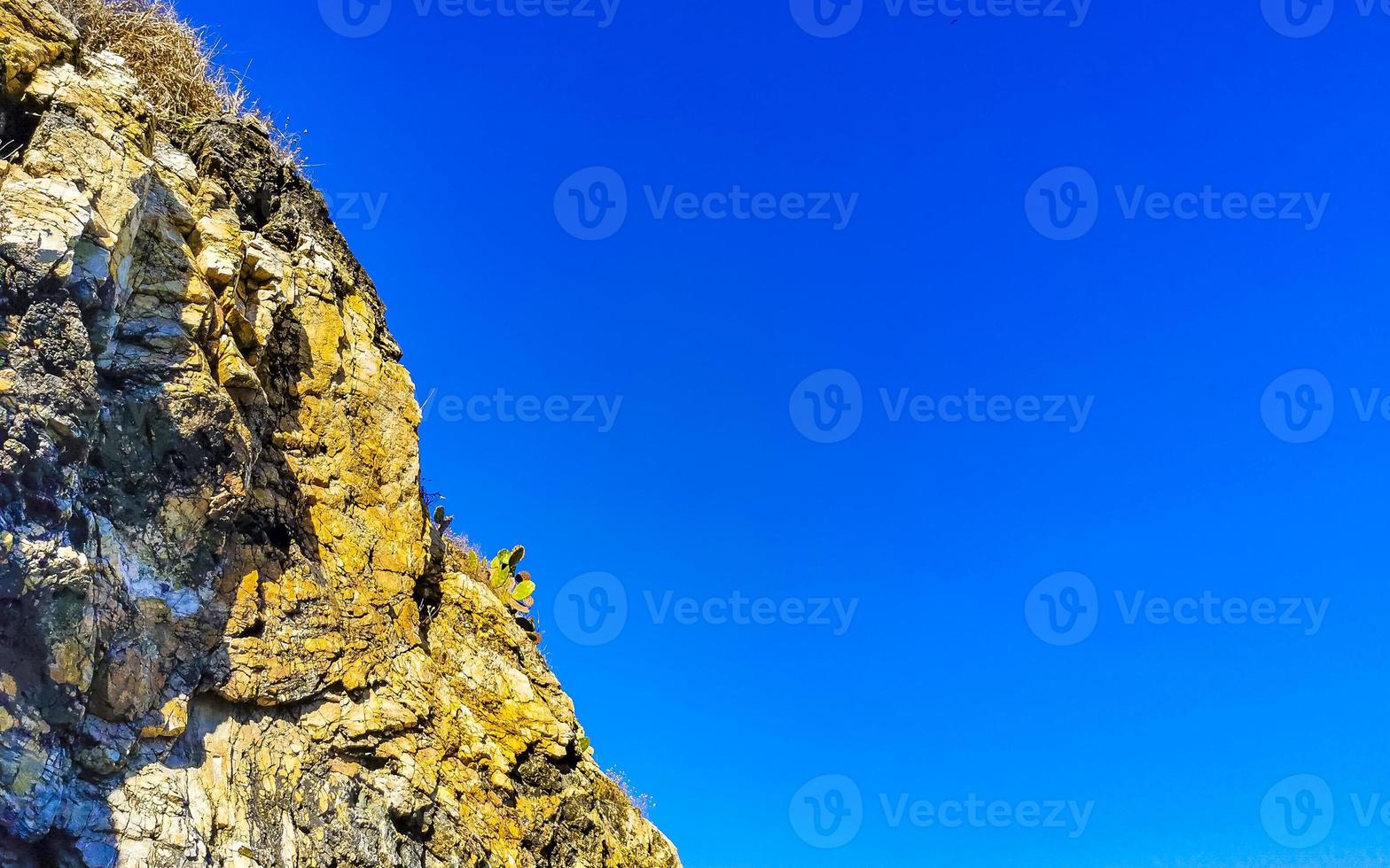 Mountain panorama cliffs rocks hilly tropical landscape Puerto Escondido Mexico. photo