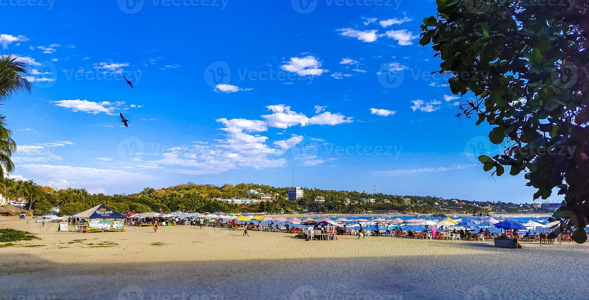 Fishing boats at the harbor beach in Puerto Escondido Mexico. photo