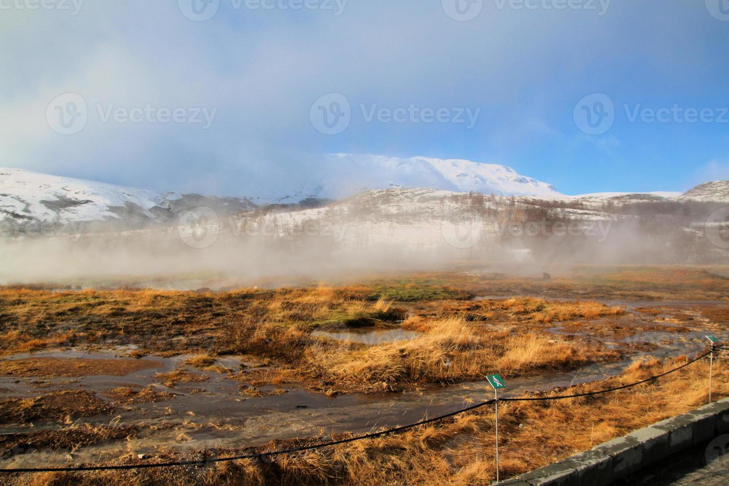 Icelandic landscape with snow covered mountains and clouds in winter. photo