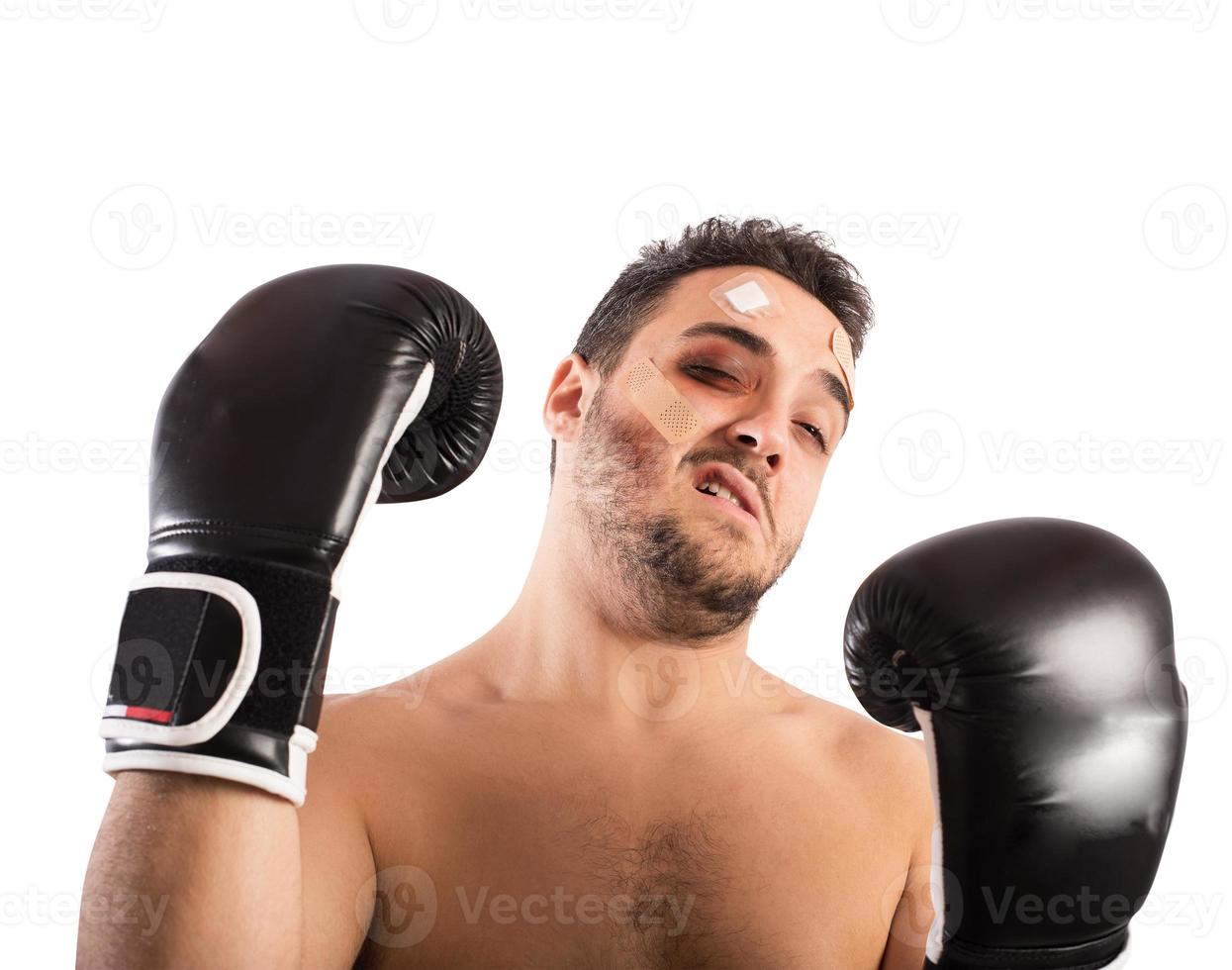 Beaten boxer on white background photo