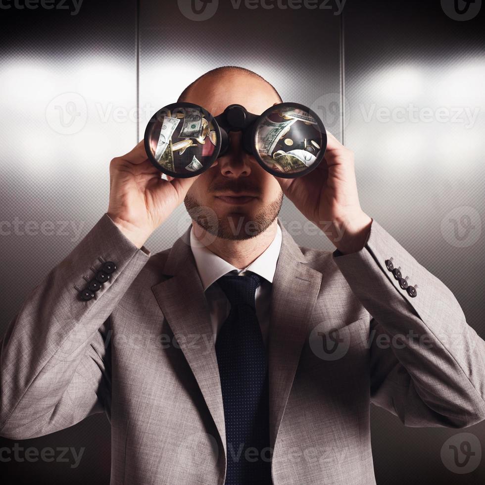 Businessman Searching for money photo