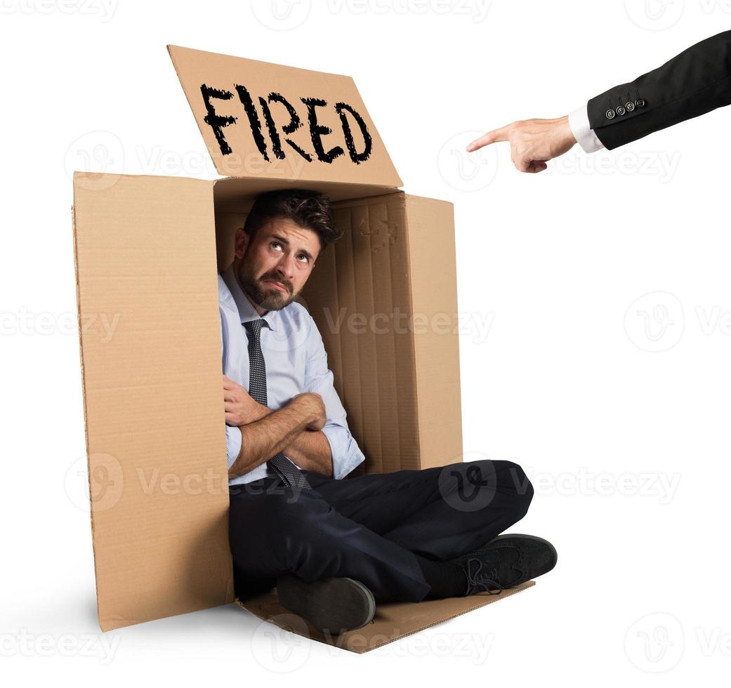 Fired businessman on white background photo