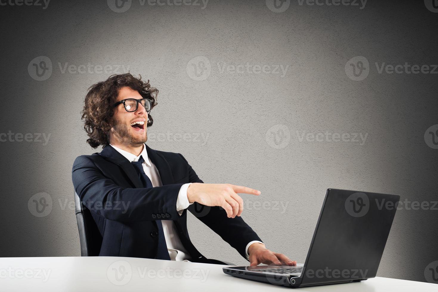 Businessman laughing and mocking photo