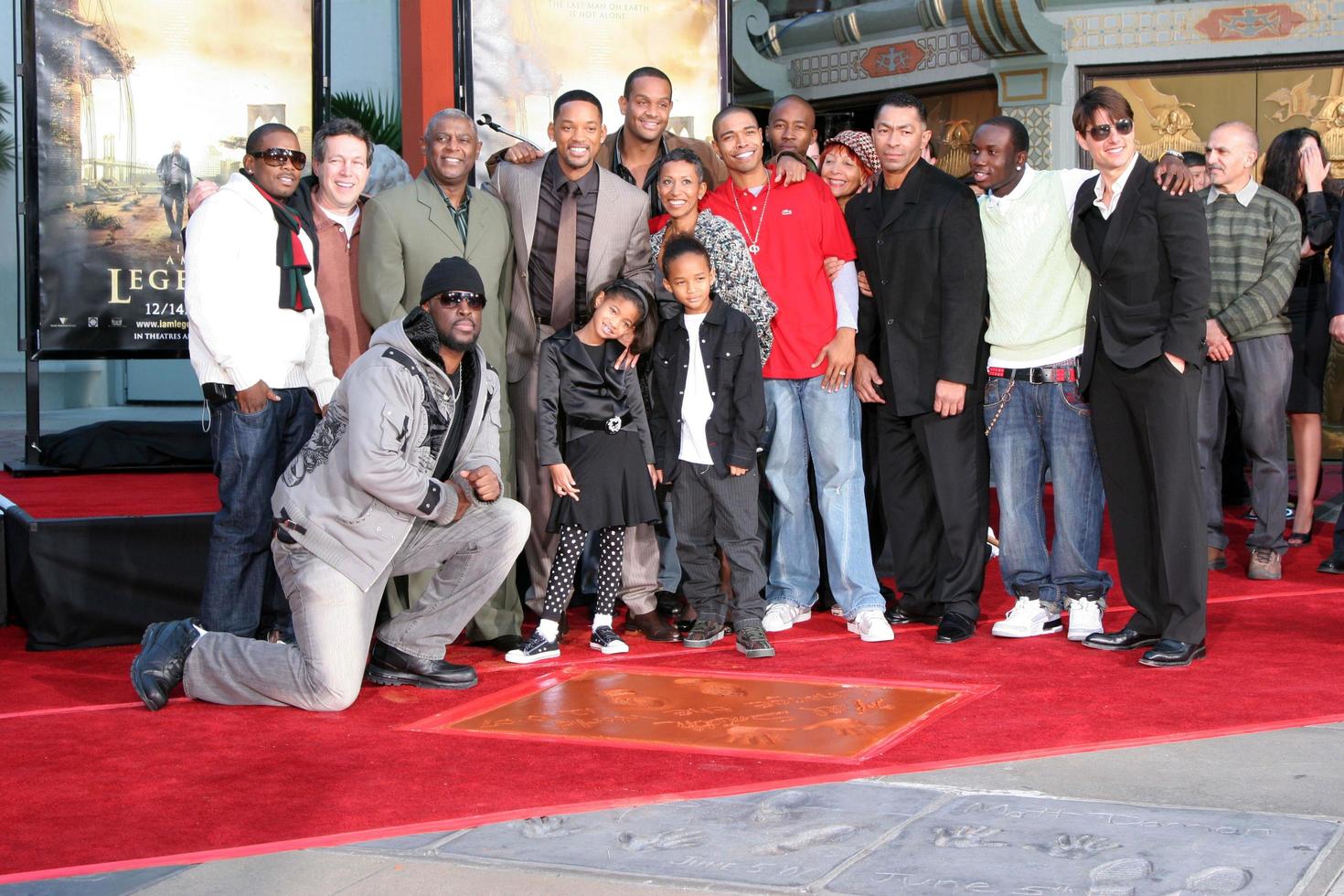 Will Smith with his family  Friends  and Tom CruiseWill Smith Handprint and Footprint Ceremony Graumans Chinese Theater ForecourtDecember 10 2007Los Angeles CA2007 photo