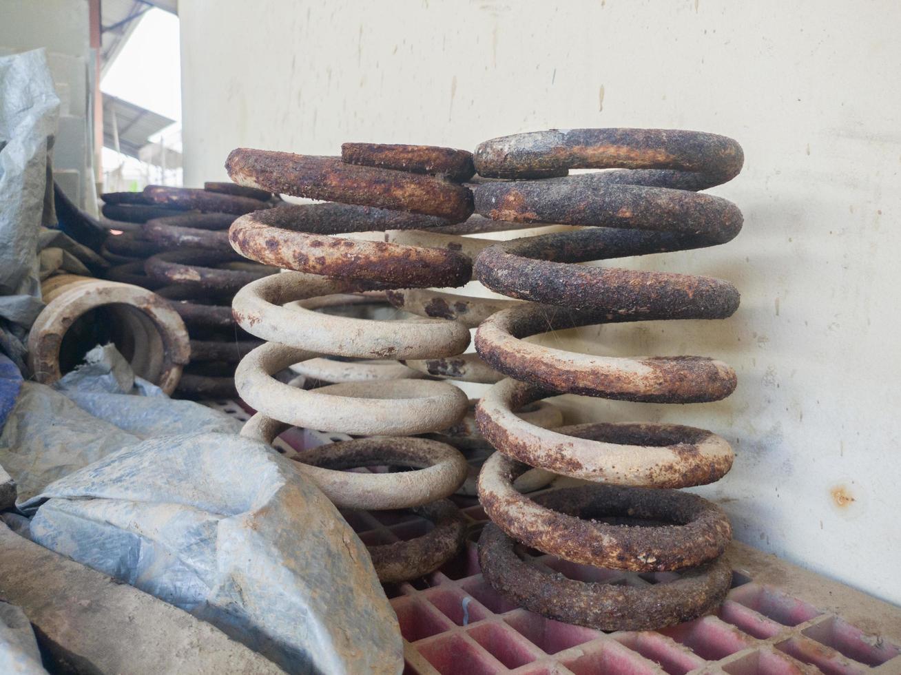 selective focus on rusty springs which can be recycled into raw materials for sharp objects such as knives and machetes photo