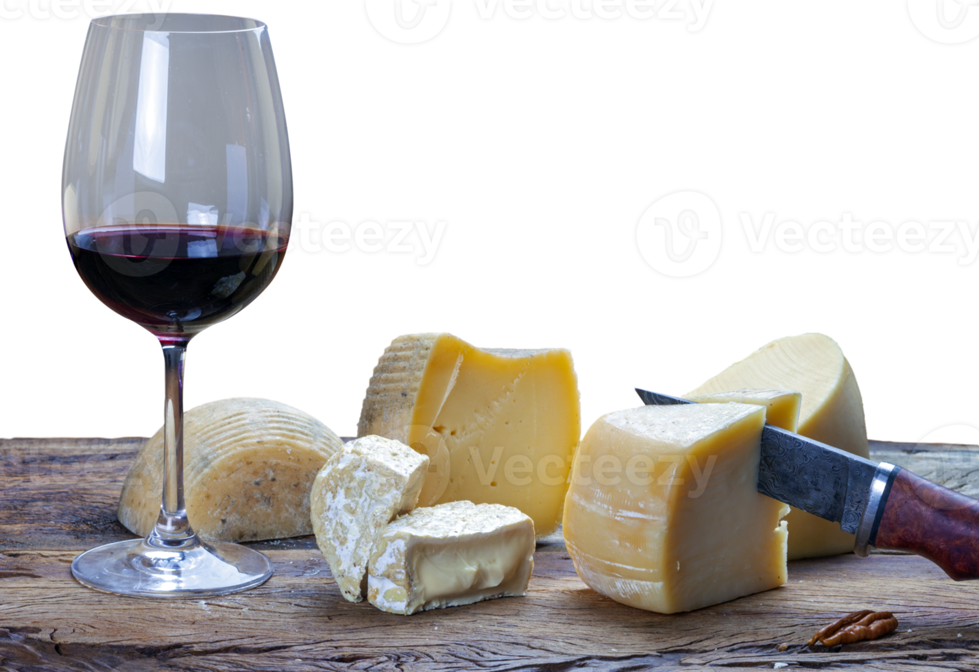 Table with a glass of red wine and various cheeses png