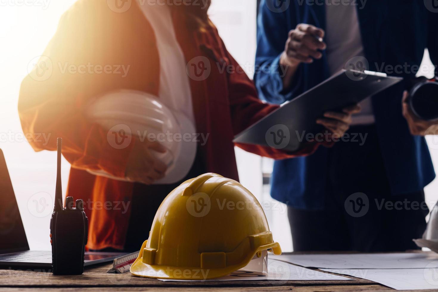 Architect concept, Architects working with blueprints in the office, Vintage Effect photo