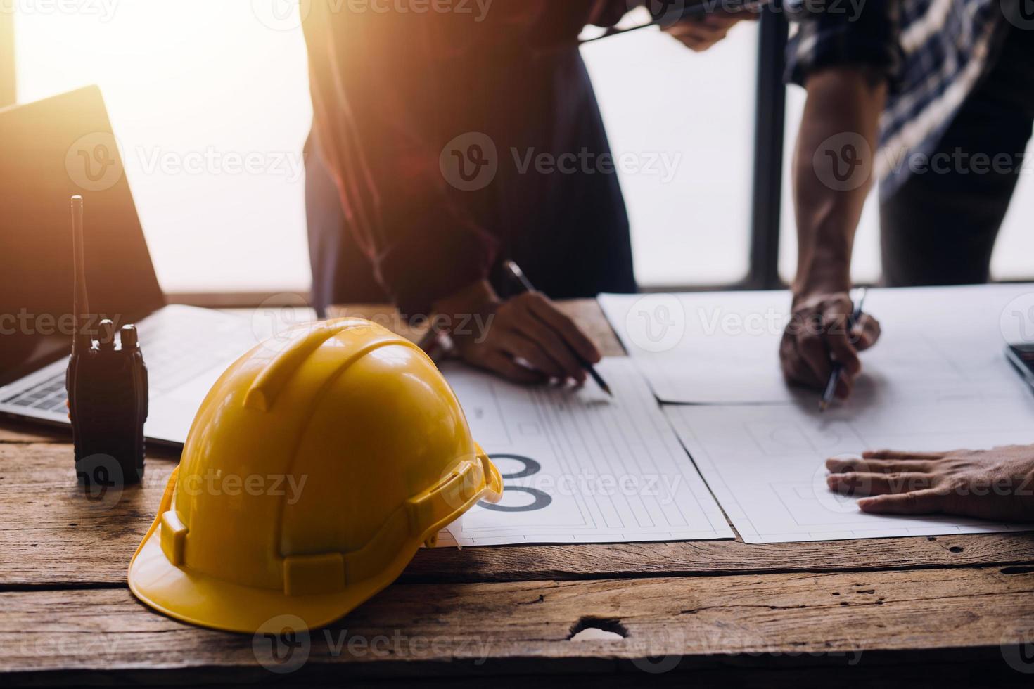Architect concept, Architects working with blueprints in the office, Vintage Effect photo