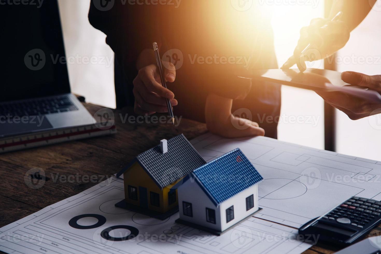 Two business man construction site engineer. Engineering objects on workplace with partners interacting on background photo