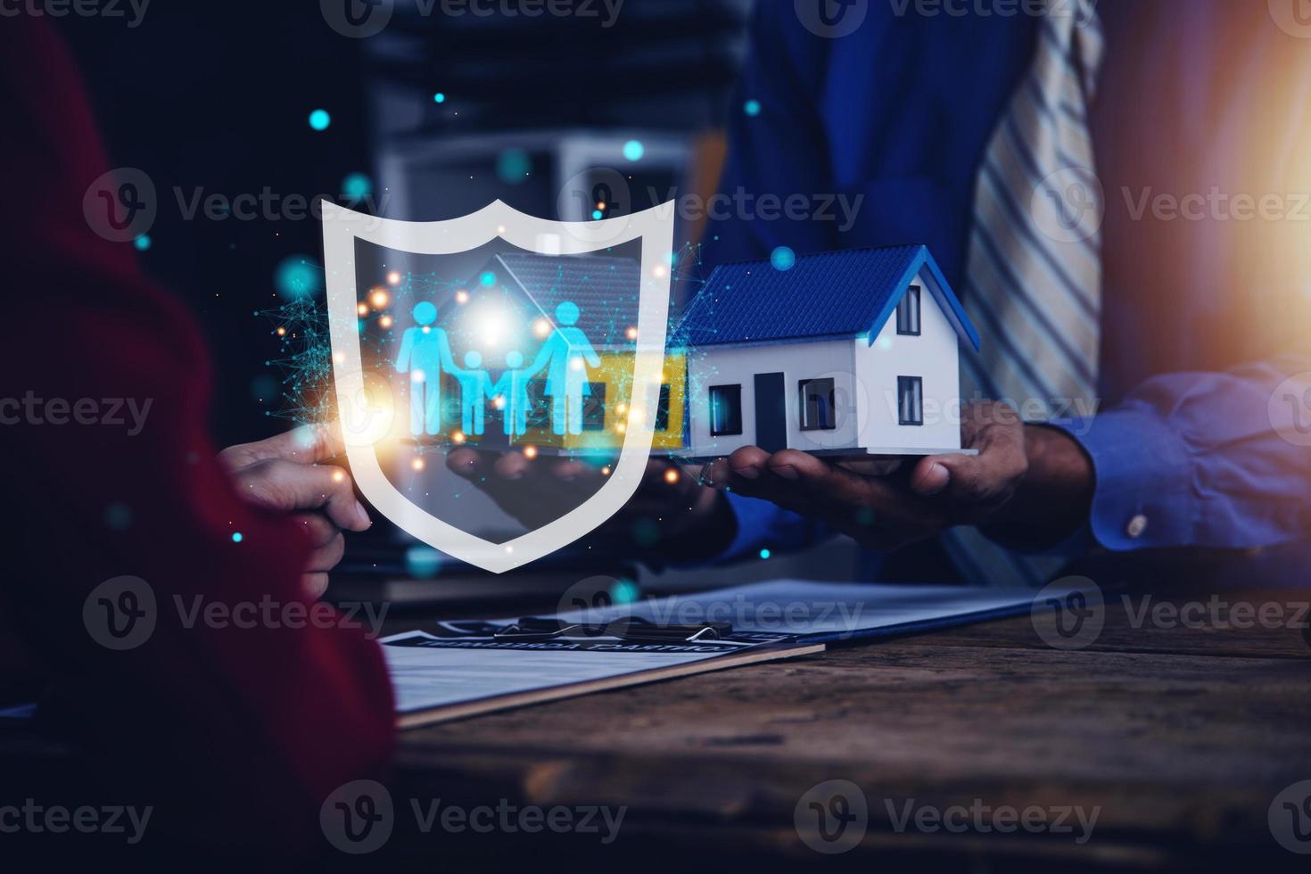 Businessman with protective gesture and family, life, health and house insurance icons. Insurance concept, Family life insurance and policy concepts. photo