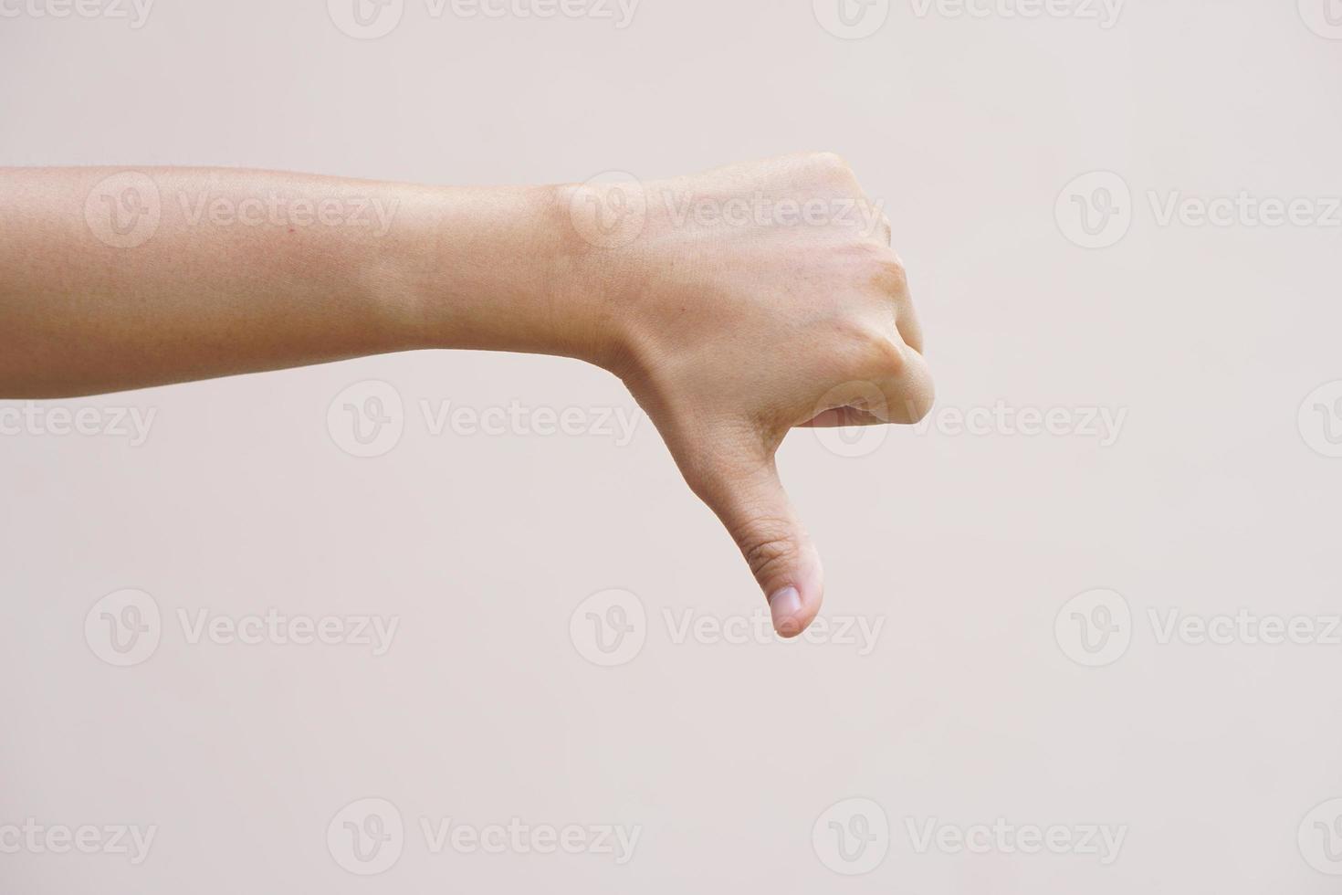 Asian woman making hand dislike sign photo
