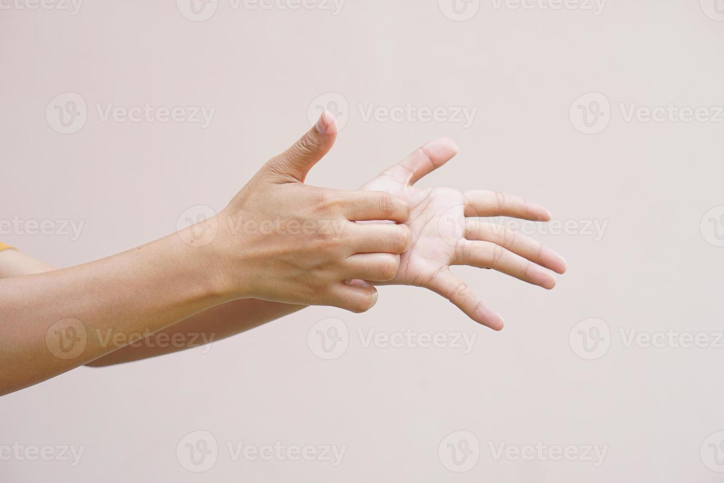 Asian woman having itchy skin on hands photo