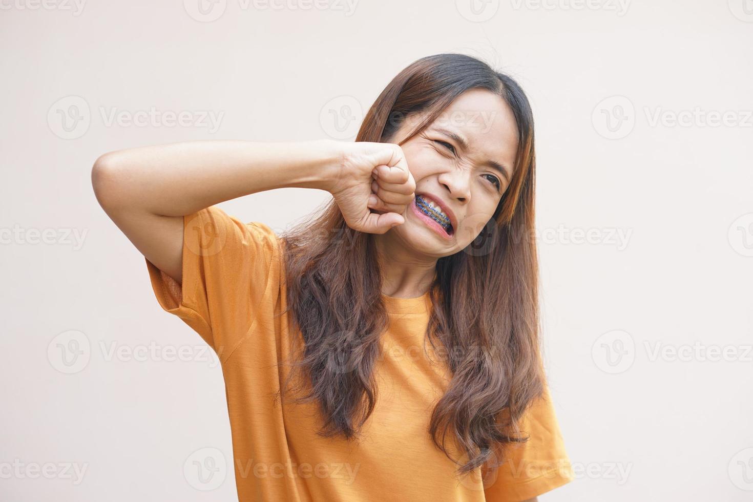 Asian woman punches herself out of anger photo