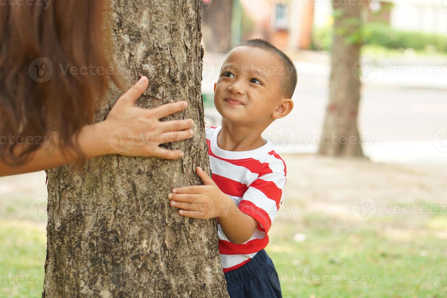 Mother and baby playing in the park happily. photo