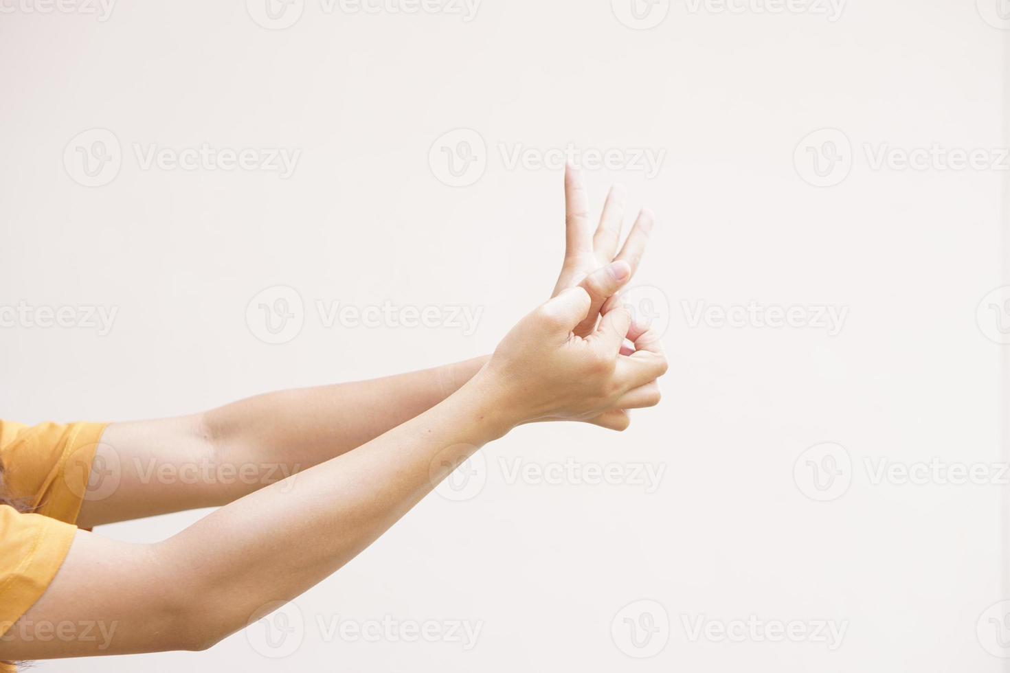 Asian woman having itchy skin on hands photo