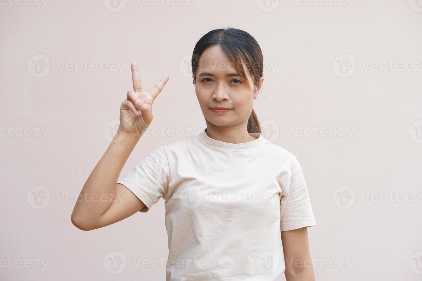 Asian woman smiling happily accomplishing tasks photo