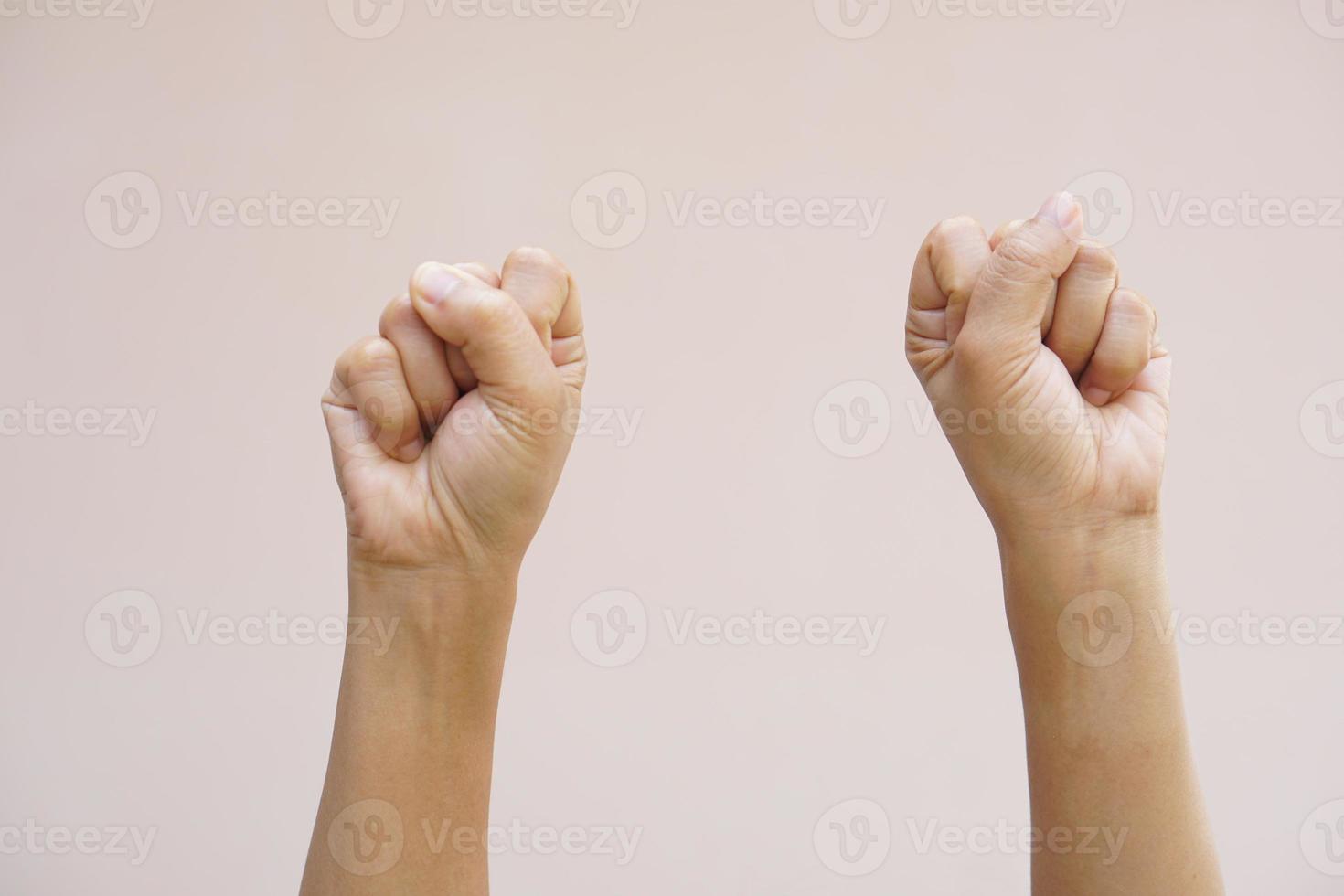 Asian woman clenching her fist photo