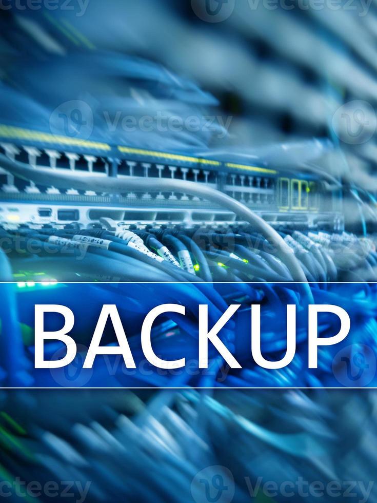 Backup button on modern server room background. Data loss prevention. System recovery. photo