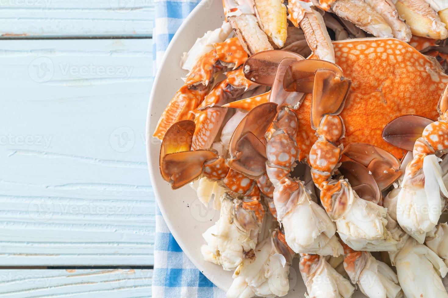 Steamed blue crab with spicy seafood sauce photo