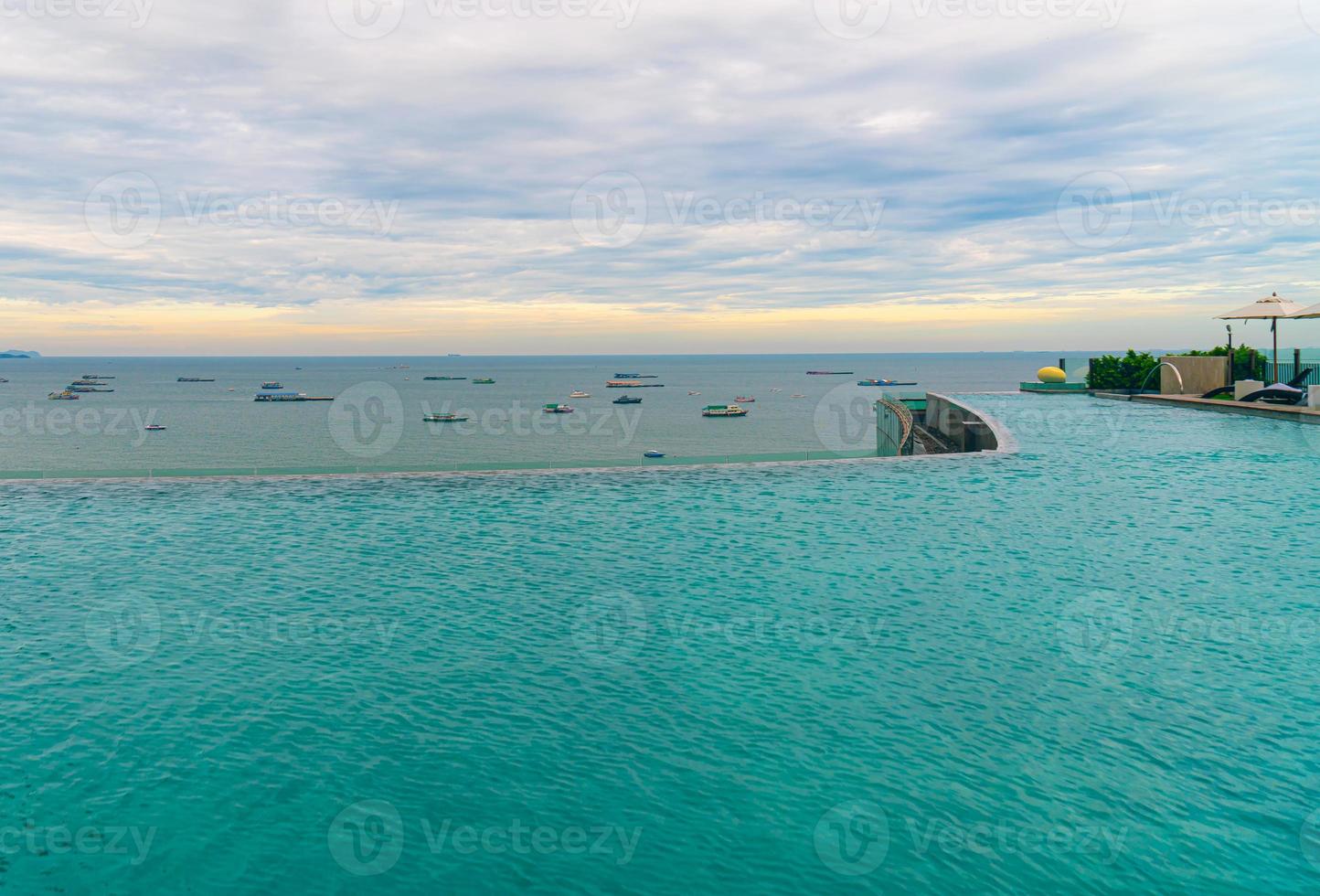 swimming pool with ocean sea and boat background photo