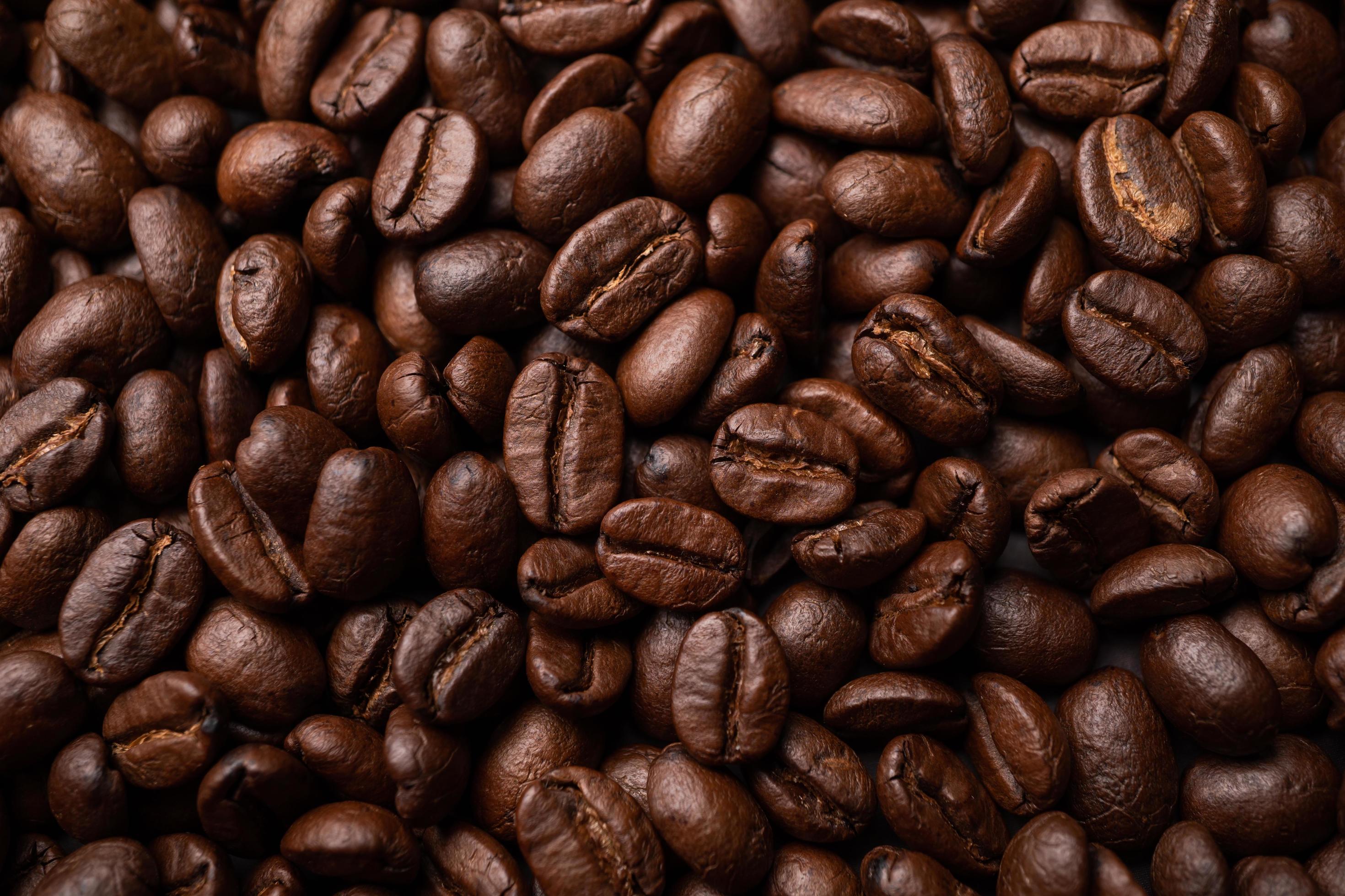 Close up of group black coffee beans. Strong black espresso, Grounds of coffee background