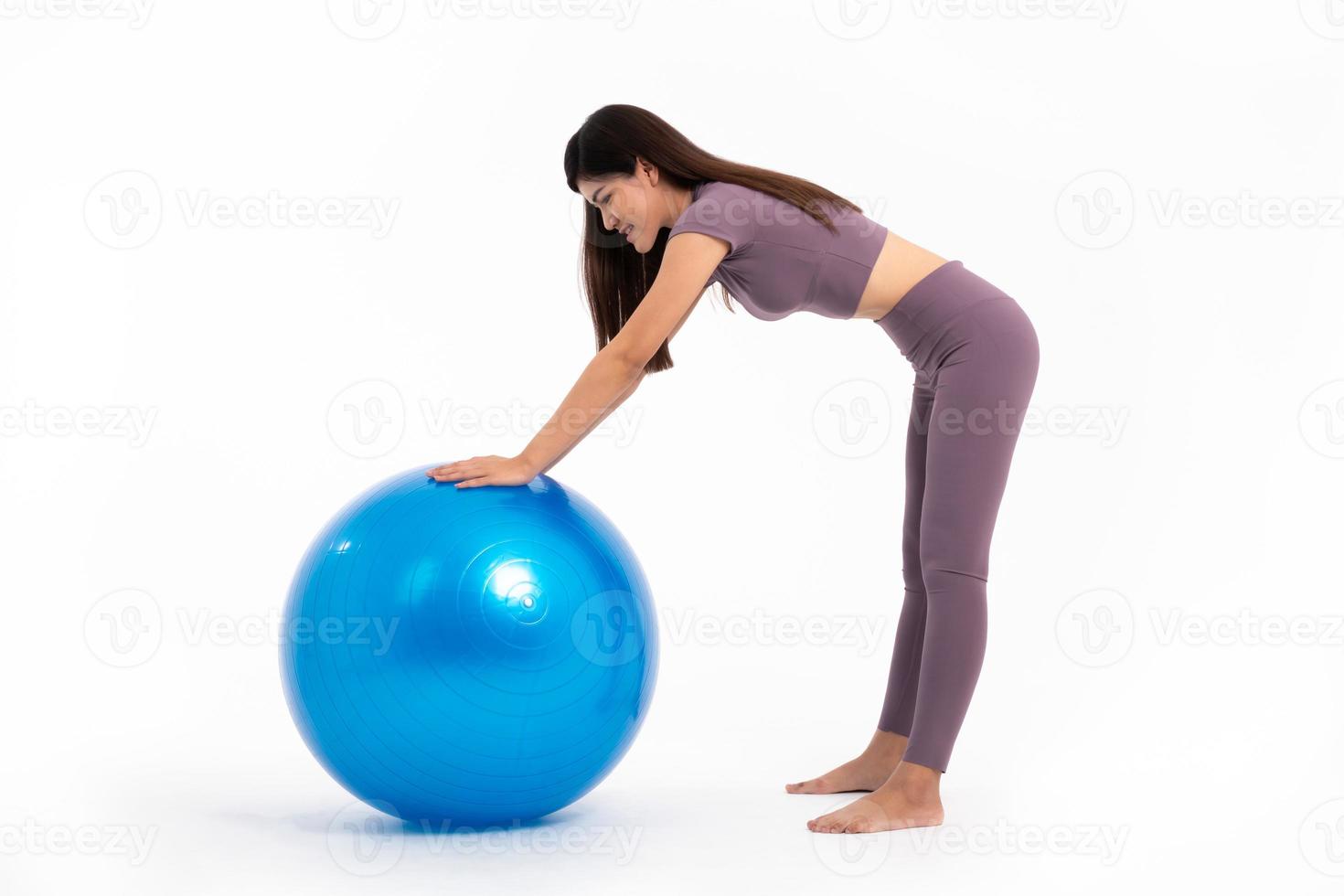 Healthy Asian woman workout with fitball on isolated white background, Concept of good health starts with exercise. photo