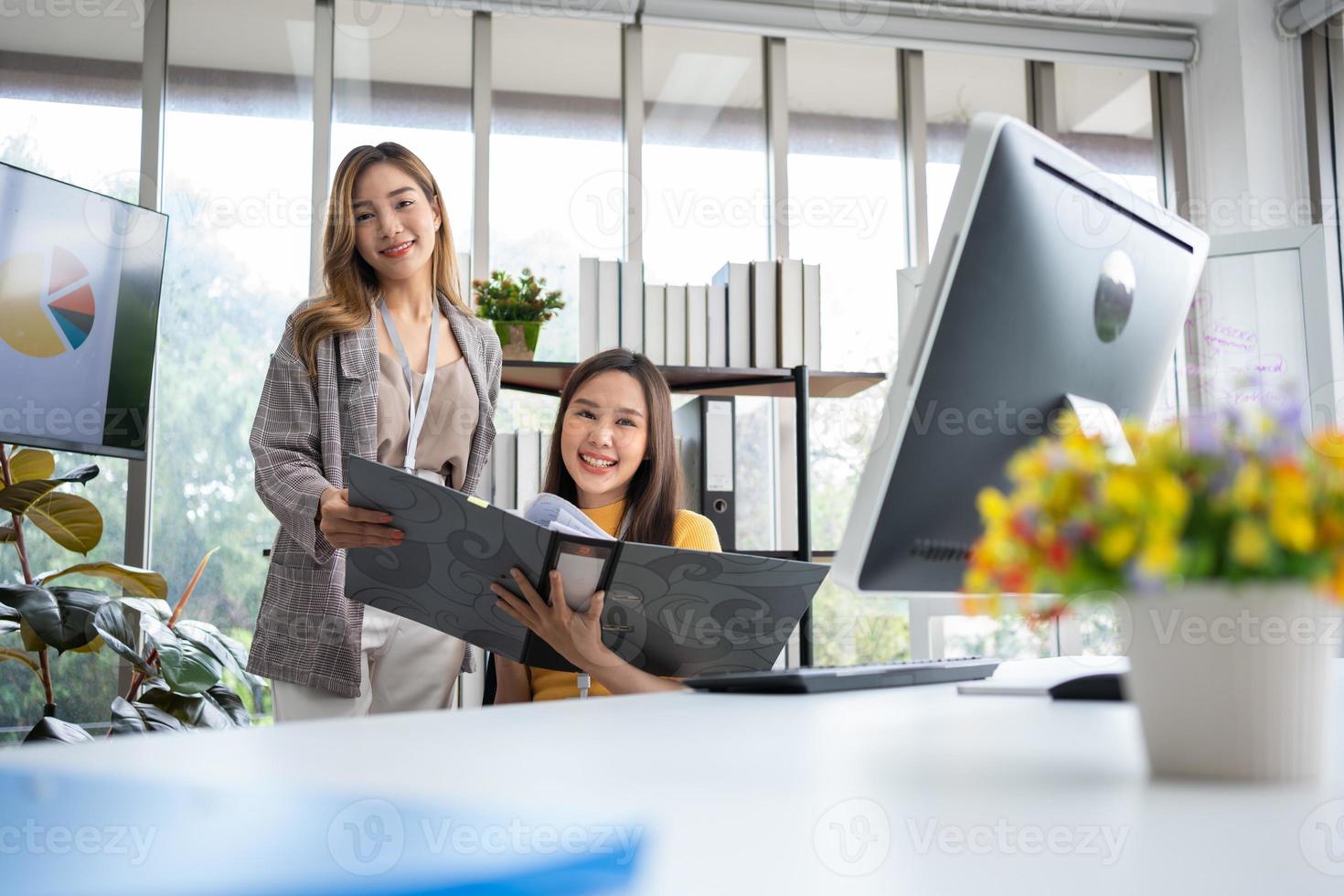 Successful team of new business startup people working together in creative office, happy euphoric proud Asian male and female professional winner feel overjoyed photo