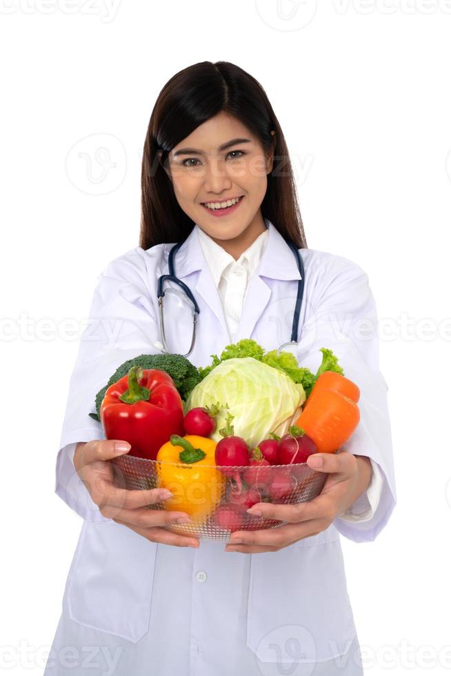 Doctor or nutritionist holding fresh fruit Orange, red and green apples and smile in clinic. Healthy diet Concept of nutrition food as a prescription for good health, fruit is medicine photo