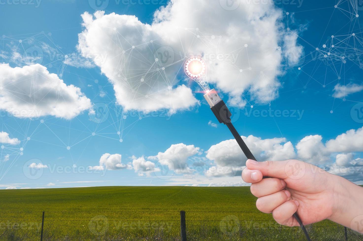 cloud computing concept, multi exposure, hand holding cable to connecting to cloud technology and ideas photo