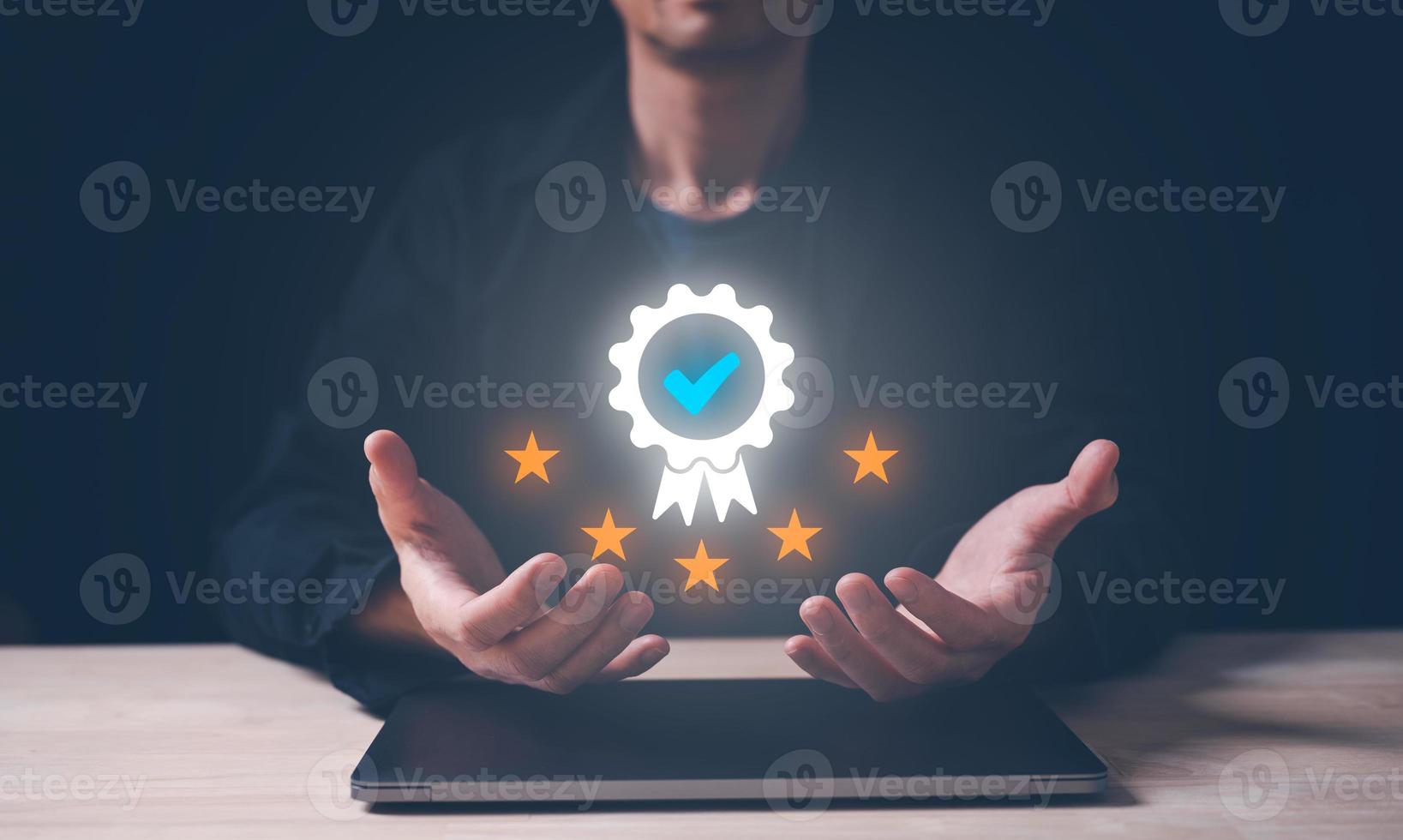 Businessman holding and showing the best quality assurance with golden five stars for guarantee product and ISO service concept. top quality excellect services. photo