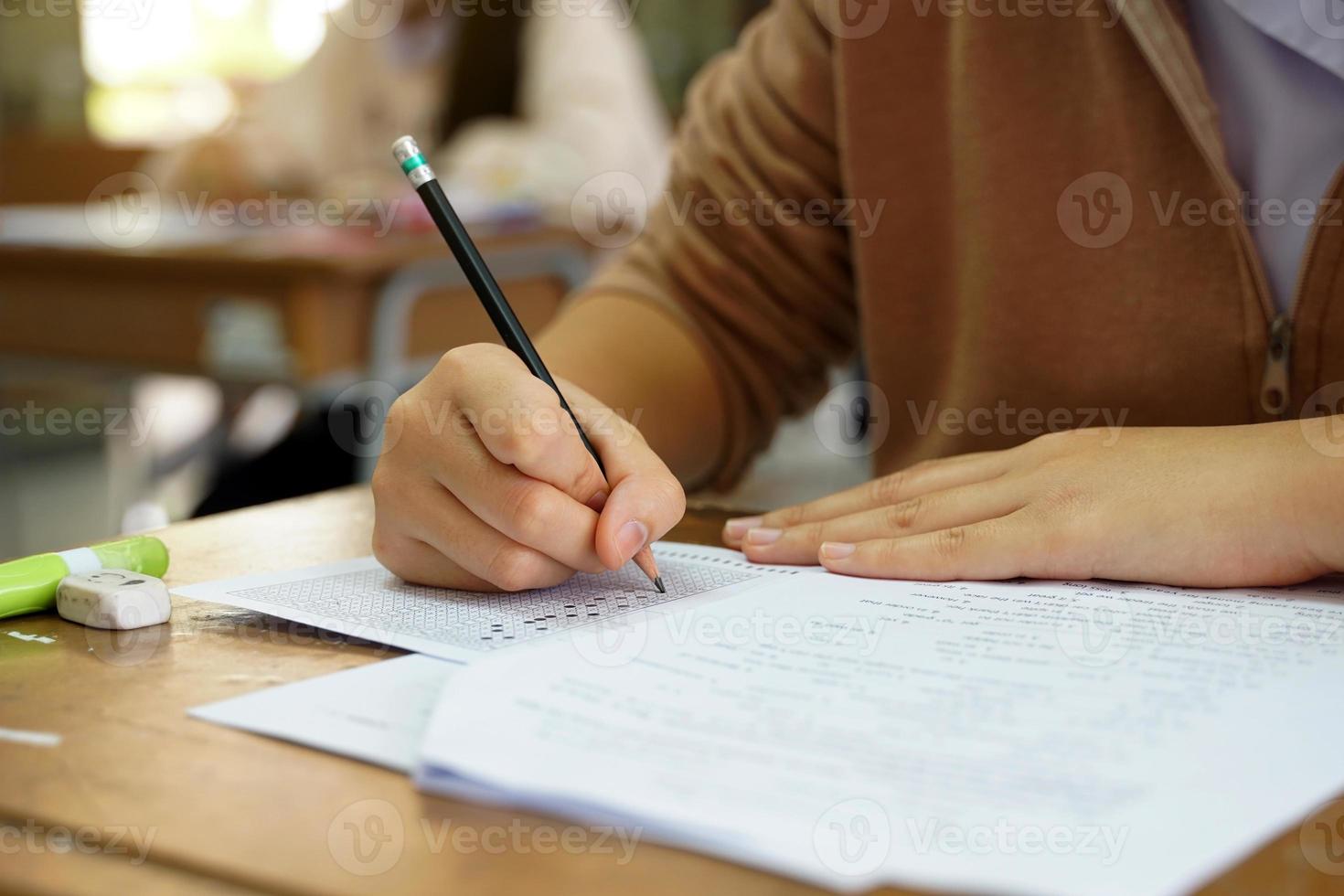 Thai students take a knowledge test to assess knowledge skills. The result of the exam will come out as a score value. Allows us to analyze the results or grade. Soft and selective focus. photo