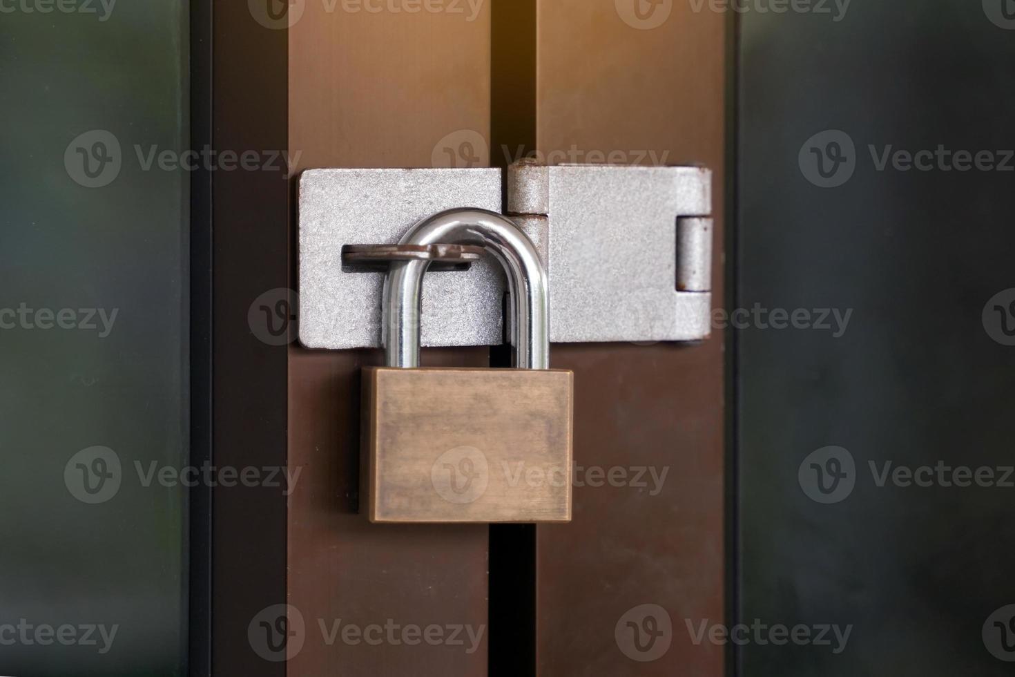 padlock  or door lock key Type for use with door-hasp ,Made of strong metal, locks firmly Prevents tampering from thieves.soft and selective focus. photo