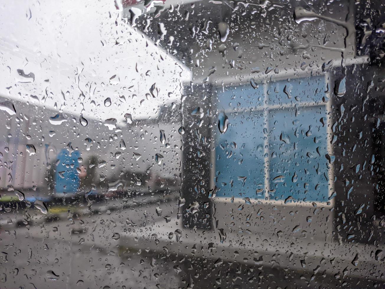 a raindrops dripping down the windshield of the car. For raindrops background. No people photo