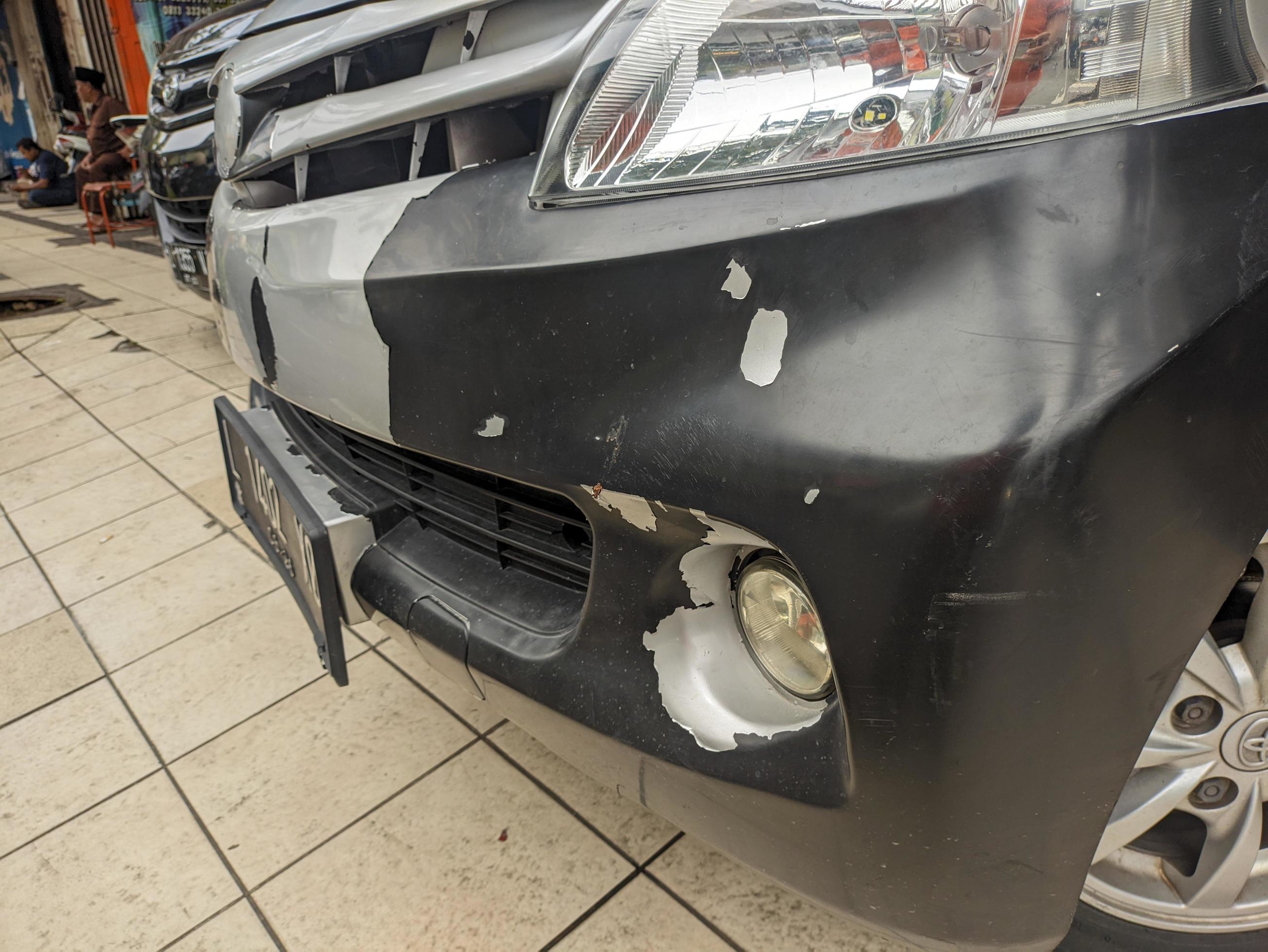 A car front bumper with peeling white paint 21223218 Stock Photo at