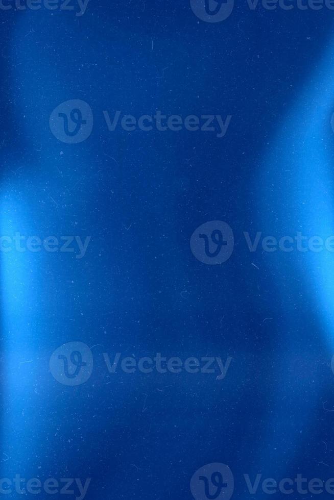 Abstract retro grunge decorative relief with film dust texture and blue gradient colors. Rough colored illustration background. photo