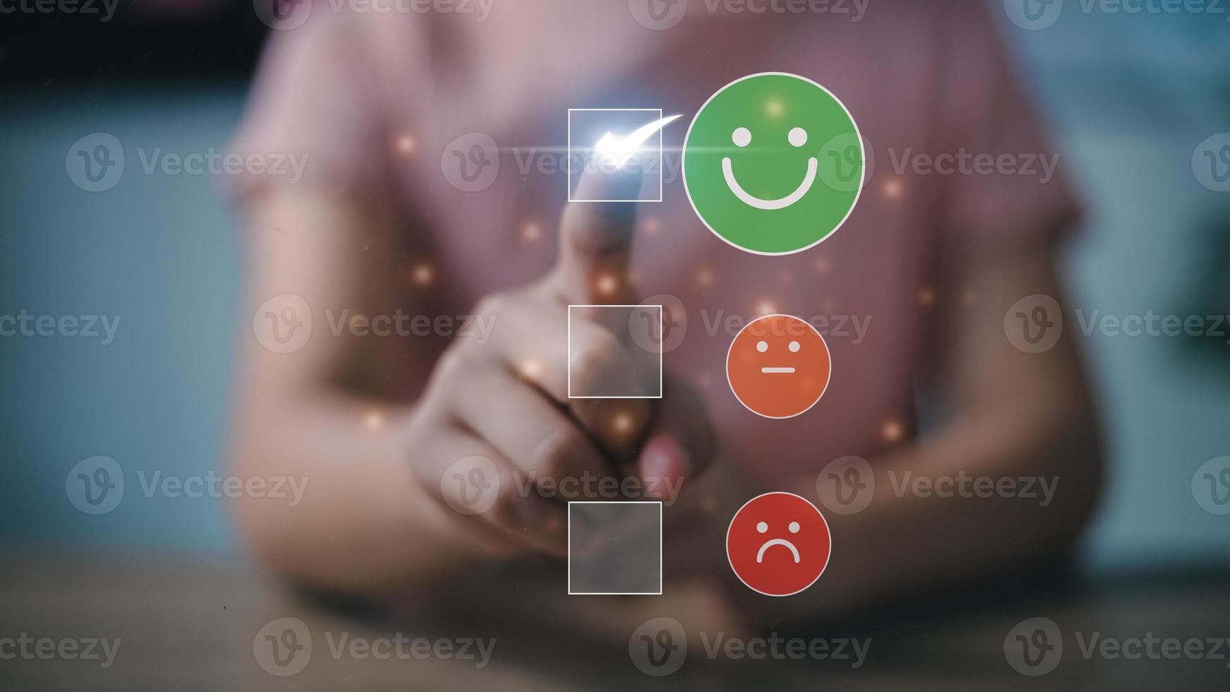Women choosing on the happy Smile face icon, a positive mindset selection. Customer service and Satisfaction concept, feedback, review, feedback, best quality. photo