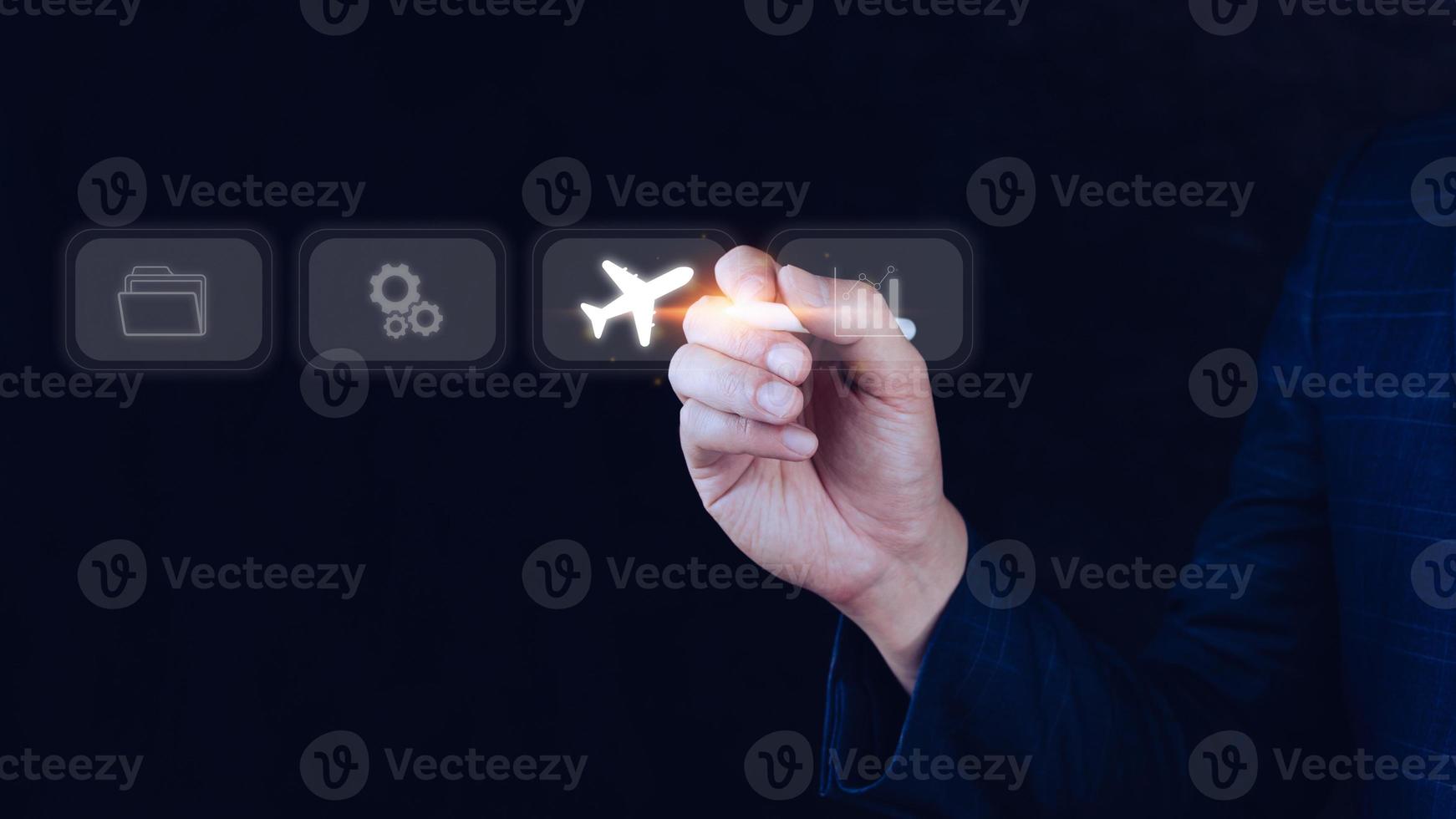 Businessman pointing finger touching to select flight by pressing touch screen airplane button,Business Airplane transportation concept photo