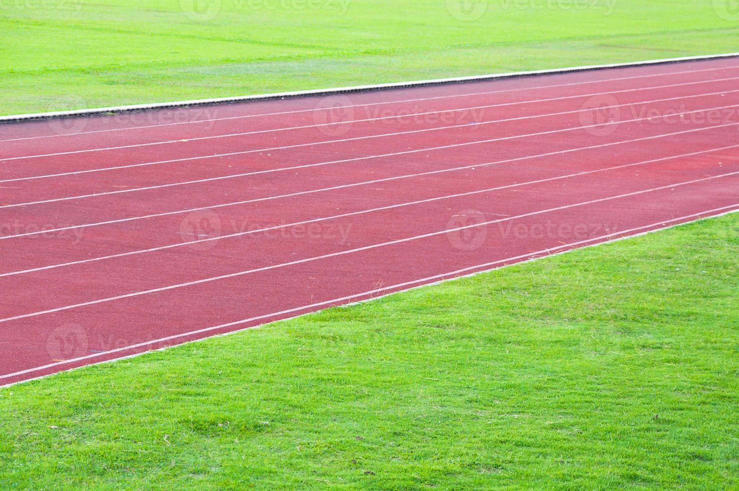 running track and green grass,Direct athletics Running track at Sport Stadium photo