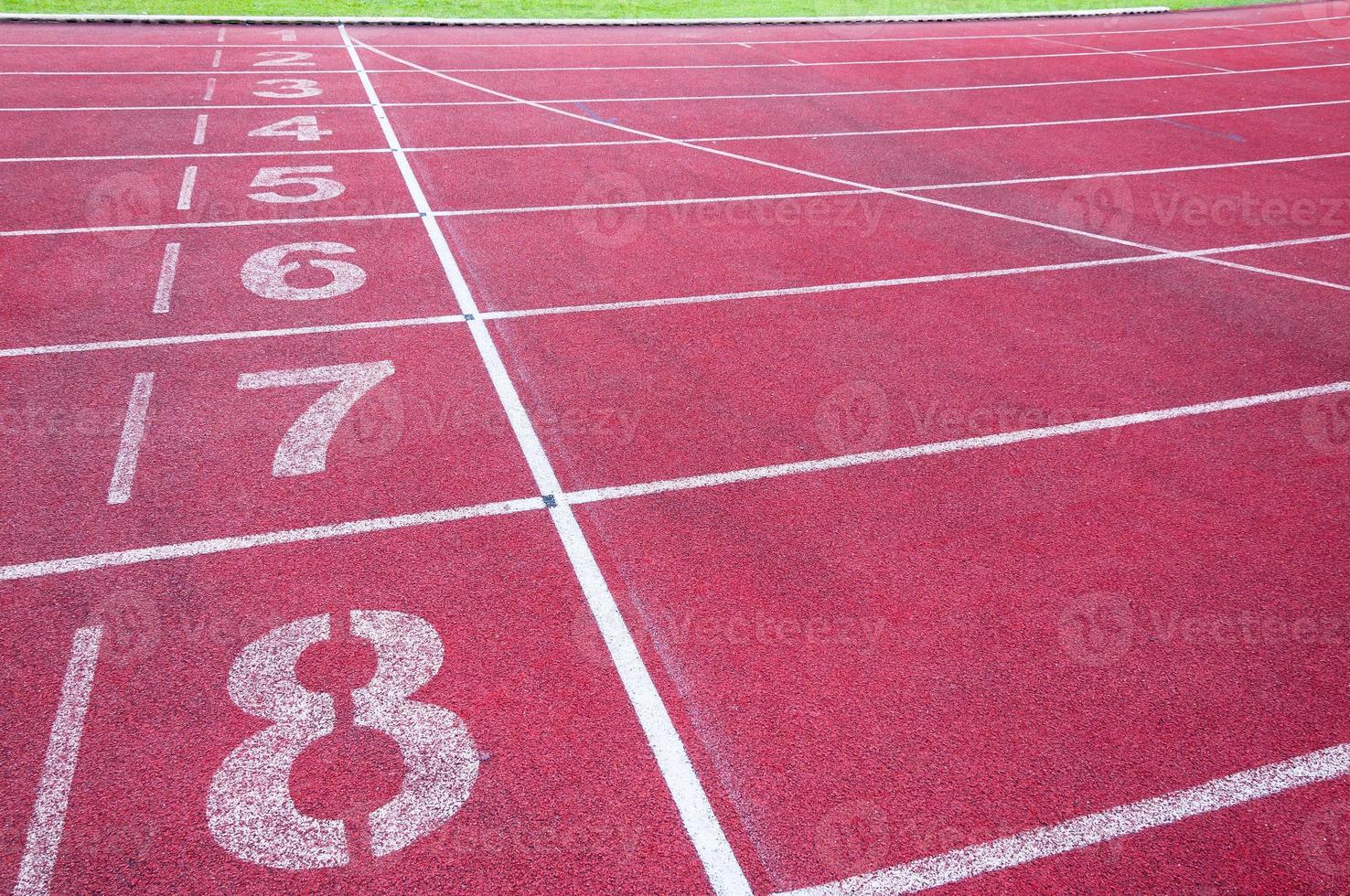 Numbers starting point on red running track,running track and green grass,Direct athletics Running track at Sport Stadium photo