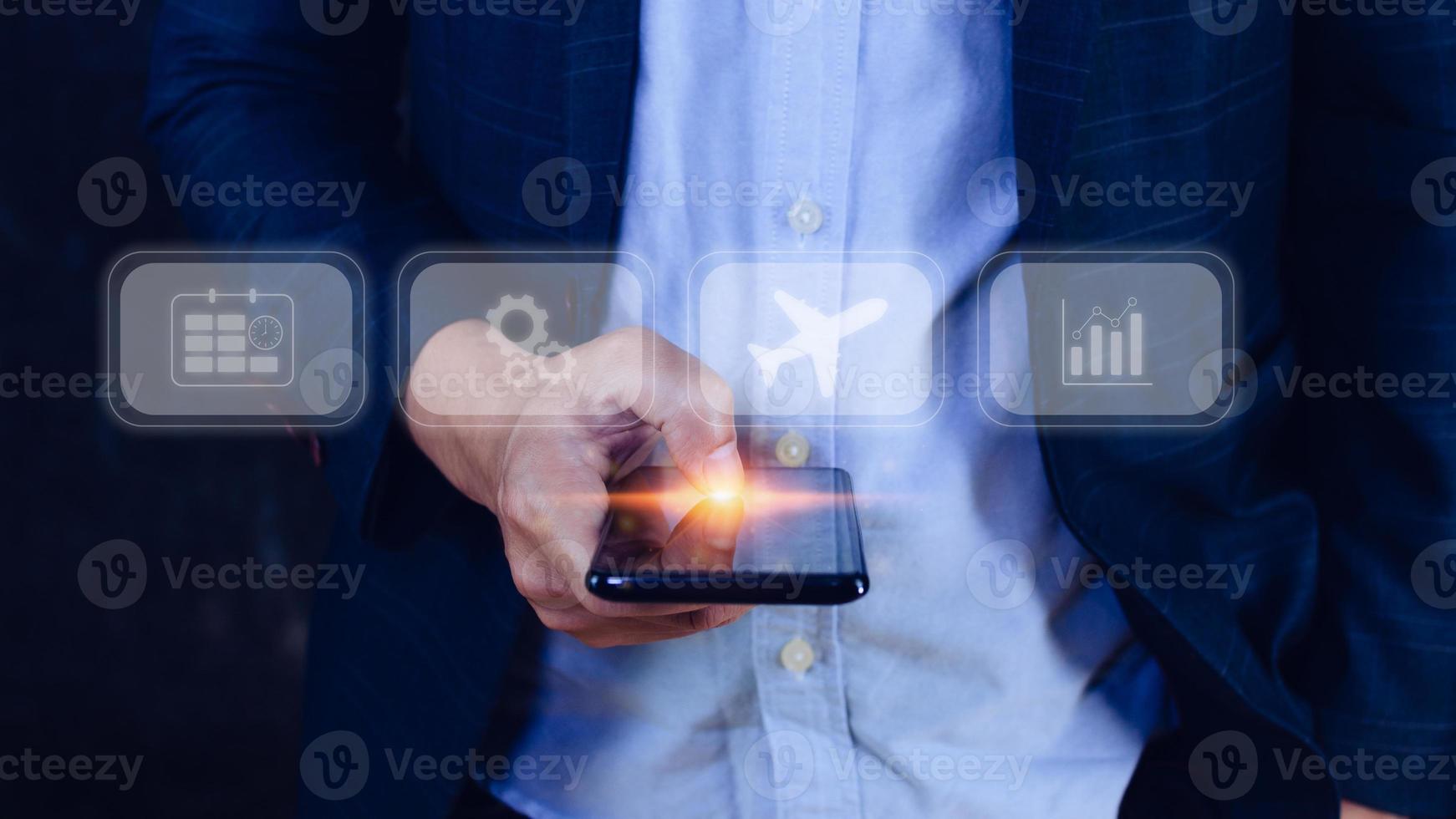 Businessman touching smartphone to select flight by pressing touch screen airplane button,Business Airplane transportation concept photo