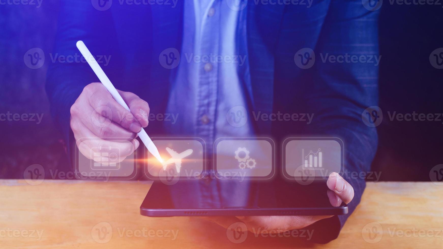 Businessman pointing finger touching to select flight by pressing touch screen airplane button,Business Airplane transportation concept photo