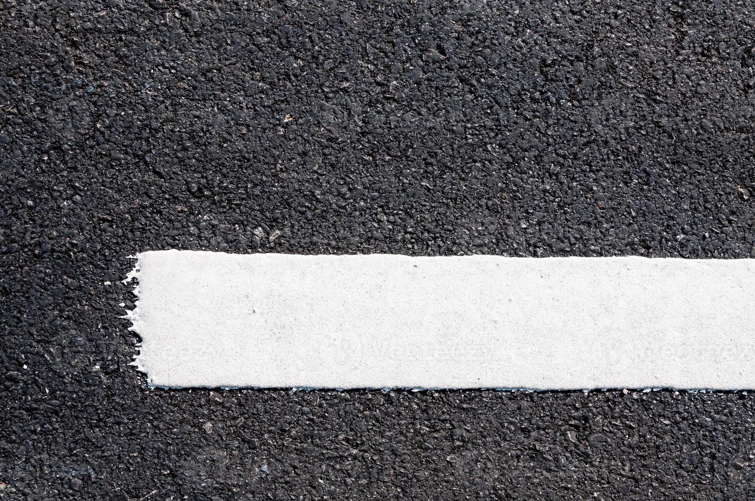 White line on new asphalt detail,Street with white line texture photo