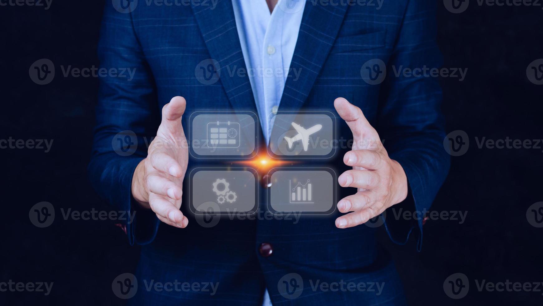 Businessman holding touching to select flight by pressing touch screen airplane button,Business Airplane transportation concept photo