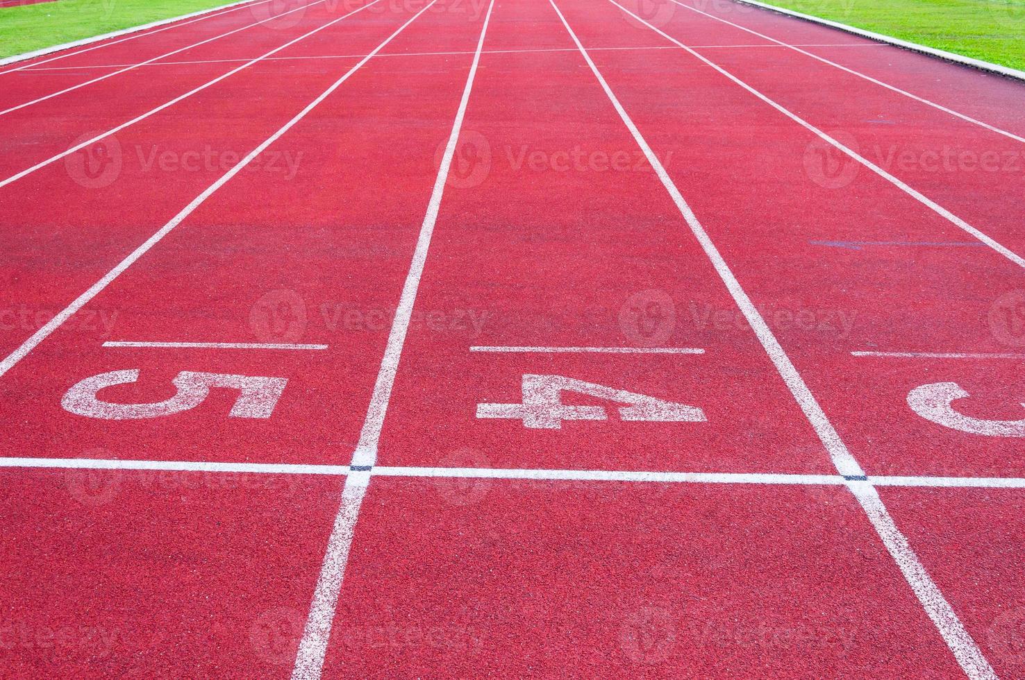 Numbers starting point on red running track,running track and green grass,Direct athletics Running track at Sport Stadium photo