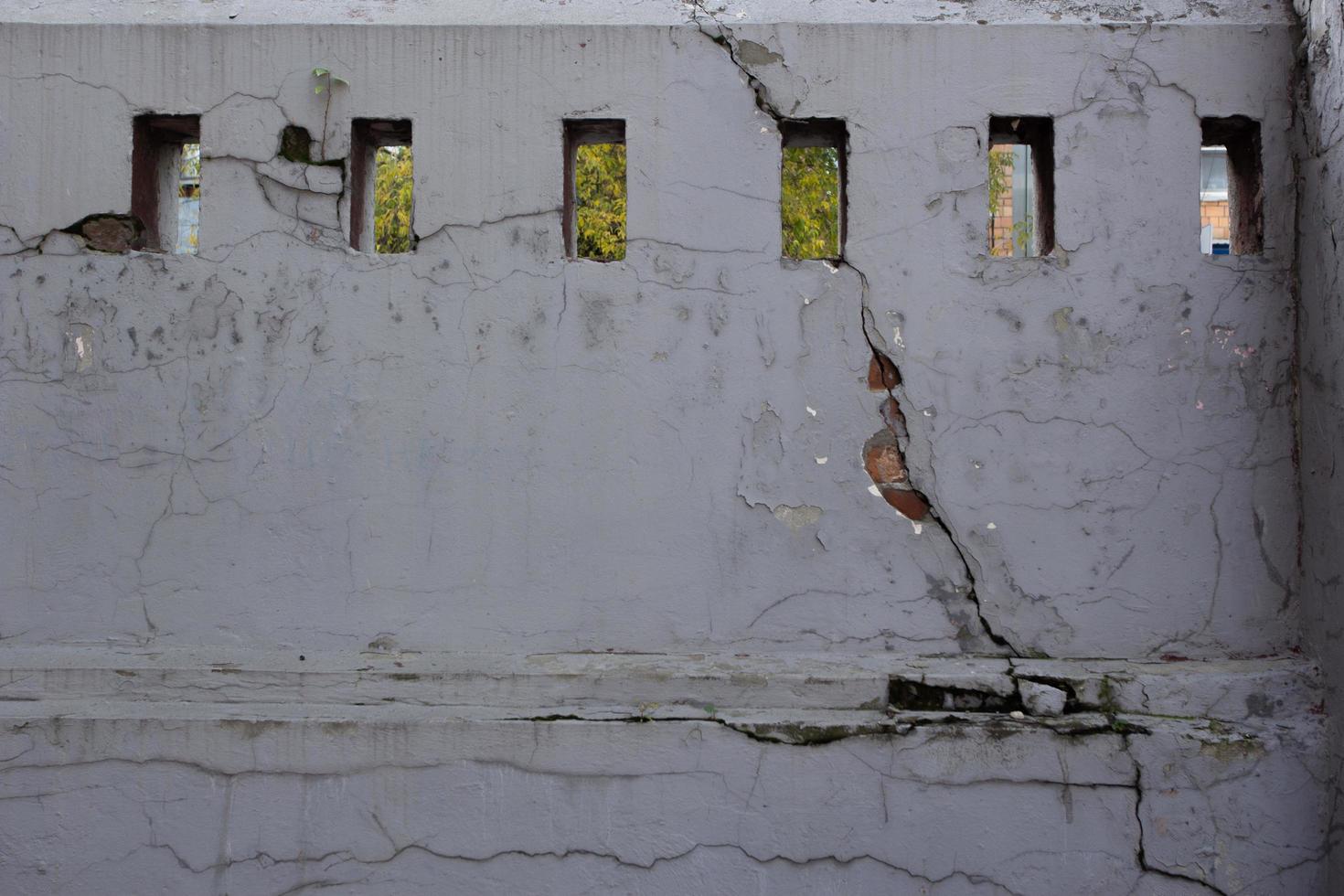Abstract background is an old ruined white wall. photo